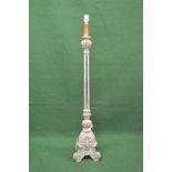 Carved and painted standard lamp the light fitting supported on a triangular painted and mirrored