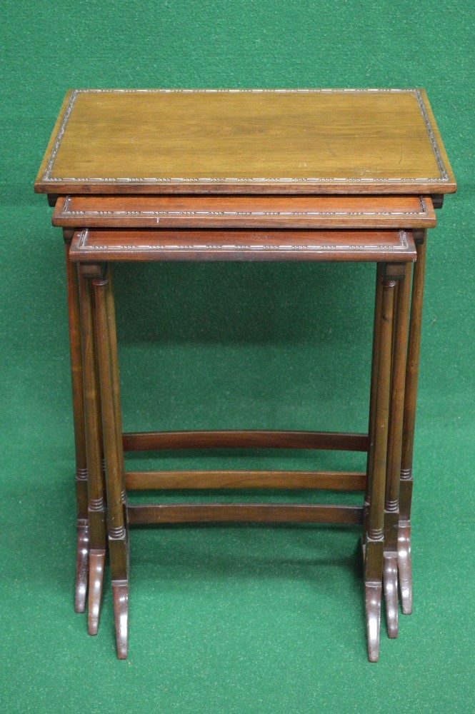 Nest of three mahogany graduated tables having rectangular tops supported on stretchered outward