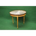 Circular painted marble topped drinks table having pierced brass gallery and supported on three