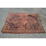 Rust ground rug having blue and cream decoration (af) - 64" x 46"