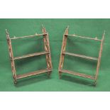 Pair of painted open wall shelves having three fixed shelves supported by pierced uprights - 17.