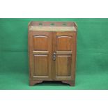 Circa 1900 Arts & Crafts oak cupboard with spade cut out raised gallery over two panelled doors