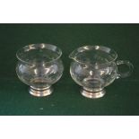 Matching glass cream jug and sugar bowl,