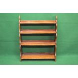 Mahogany open waterfall front bookcase having four graduated shelves supported on reeded uprights -