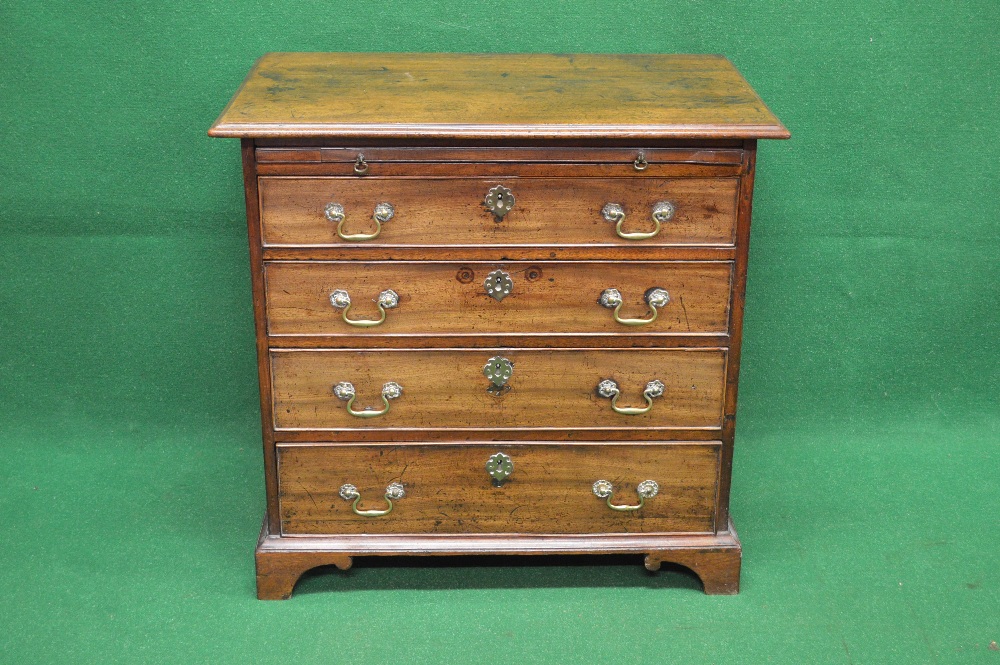 Georgian mahogany chest of drawers the top having moulded edge over brushing slide and four long