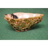 Soap stone carved libation cup having pierced and raised carved decoration of flowers and leaves -