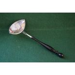 Edwardian silver sifter spoon with turned wooden handle and Import marks for London 1904