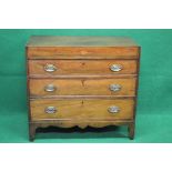 George III mahogany chest of three long graduated drawers with shaped frieze,