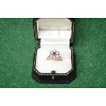 18ct white gold claw set circular ruby and diamond cluster ring comprising of one circular faceted