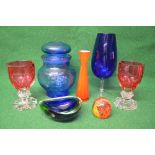 Quantity of glassware to include: two heavy Cranberry glass goblets, blue glass lidded jar,