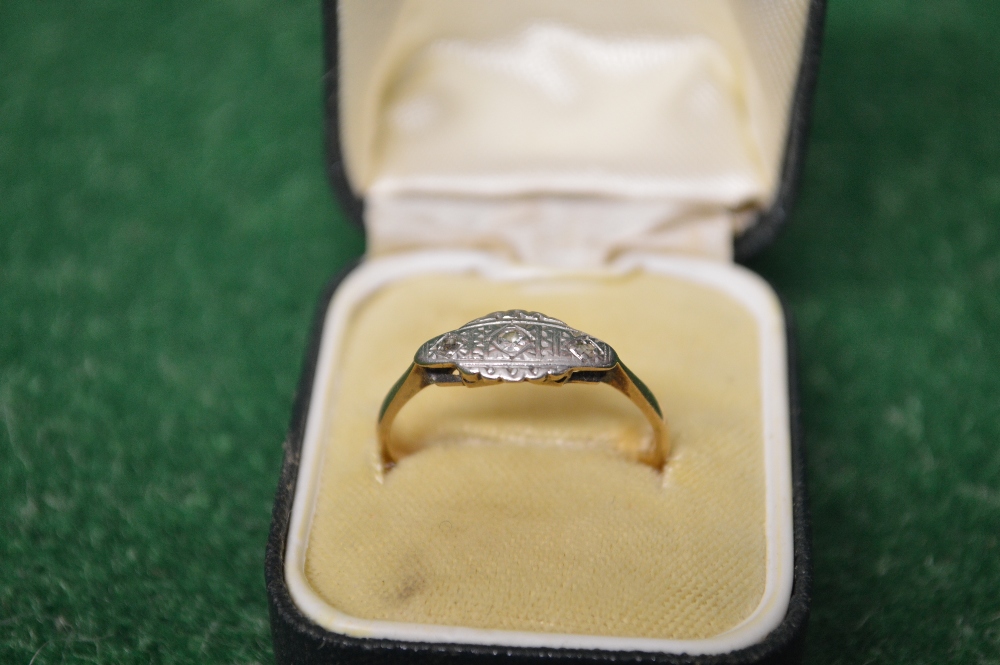 9ct gold ladies ring having three diamonds in a platinum setting