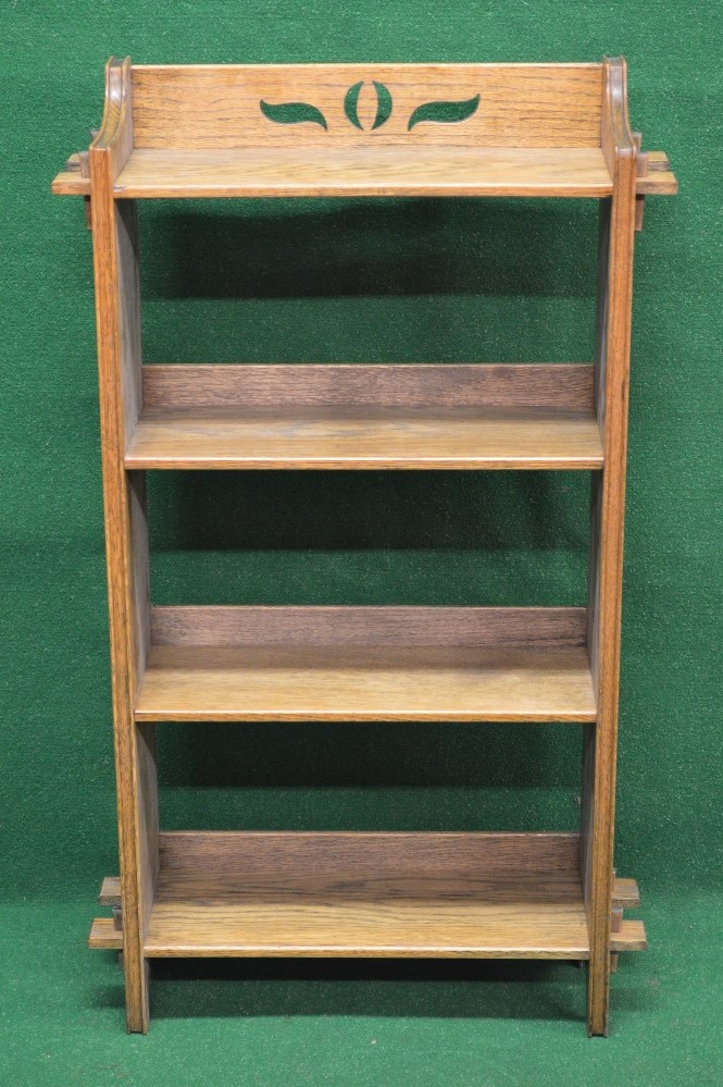 Set of possibly Scottish oak open book shelves having pierced raised back over four fixed shelves