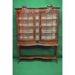 19th century mahogany inverted bow front display cabinet having two glazed bow fronted doors