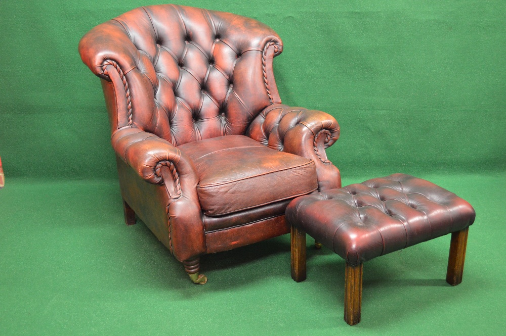 20th century red leather button back armchair together with a button leather topped foot stool with