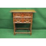 Oak Jacobean style chest of drawers the top having moulded edge over two drawers with brass handles,