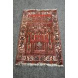 Red ground rug having black,