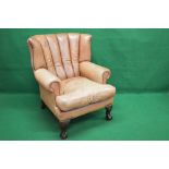 Tanned leather wing back armchair having removable seat cushion,