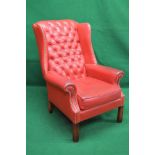 Late 20th century Georgian style red leather wing back armchair having buttoned back and studded