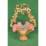 Vasaline glass and gilt painted iron basket having ribbon and floral frame cradling a vasaline