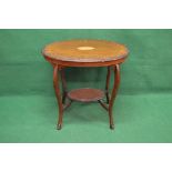 Mahogany oval occasional table having carved border with central satinwood inlaid decoration,