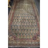 Blue ground rug having cream, brown and blue pattern - 163" x 79.