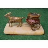 Cranberry glass and gilt metal ink well in the form of a goat pulling a carriage on a marble base -