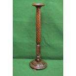 Mahogany torchere having circular top supported on twist column leading to a later circular base