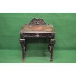 Victorian oak carved single drawer side table having raised carved back over single drawer with