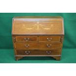 Inlaid mahogany cross banded bureau having two short drawers over two long drawers with brass