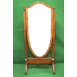 Mahogany framed cheval mirror having shield shaped mirror supported on outward tapering uprights