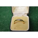 Ladies gold ring set with five diamonds,
