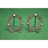 Pair of free standing oval miniature picture frames having garnet set border with opals - 2.