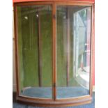 Oak glazed bow fronted two door shop cabinet - 59" wide