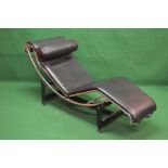 Le Corbusier style floating recliner having black leaded padded cushion on a tubular chrome frame