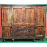 19th century mahogany triple compactum breakfront wardrobe having moulded cornice over a central