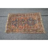 Blue and brown ground rug having red,