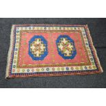 Pink ground rug having blue,