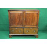 Georgian mahogany linen cupboard having two panelled doors opening to reveal three linen slides