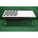White marble top coffee table with inset games board on brass curule base with lion paw feet,