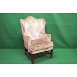 Georgian style wing back armchair having scrolled arms and removable seat cushion,