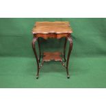 Square mahogany two tier occasional table the top having shaped edges supported on carved cabriole