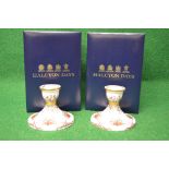 Boxed pair of Halcyon Days porcelain candlesticks having holly and ribbon decoration - 3" tall