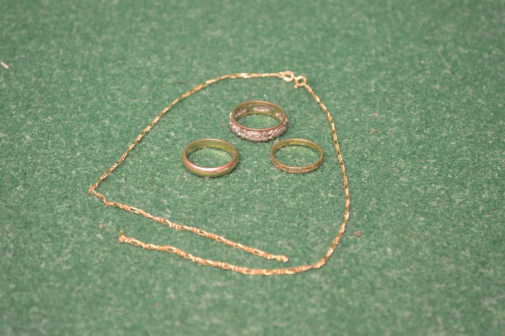 22ct gold wedding band together with two 9ct gold eternity rings and a 9ct gold broken necklace