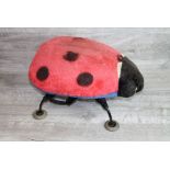 1950's Child's upholstered Ladybird Foot stool with metal legs and rubber feet