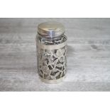 A Mexican silver collared glass jar, engraved rose and leaf openwork design full body collar, base