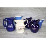 Collection of seven vintage Brewery Advertising Water jugs to include Wade examples
