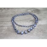 Early 20th century glass foil bead necklace, graduated beads, knotted spacers, length