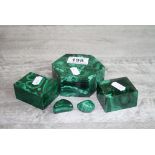 Three hardstone malachite trinket boxes and covers together with two tumbled large malachite