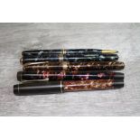 Five vintage pens comprising Conway Stewart lever fill fountain pen, two Parker Victory 14ct gold