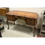 Early 20th century Walnut Ladies Writing Desk with inverted breakfront, shaped back, brown leather